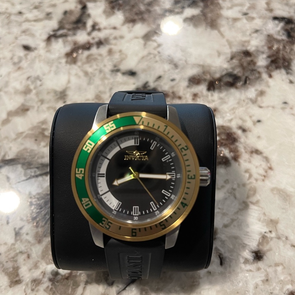 Invicta Black and Gold Watch with Green Accent